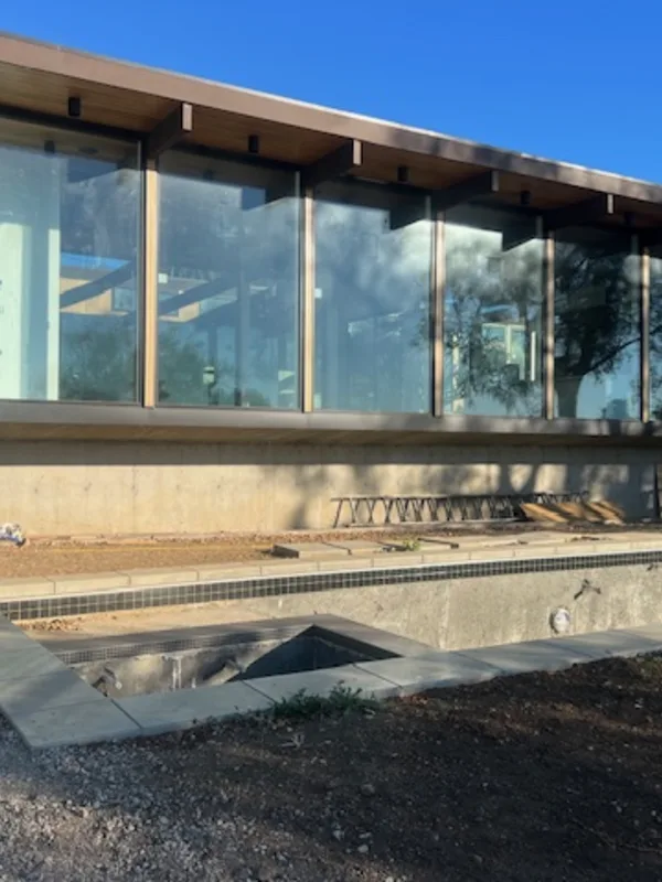 Busch Drive: the glass-and-timber pavilion nearing completion on its Malibu hillside.