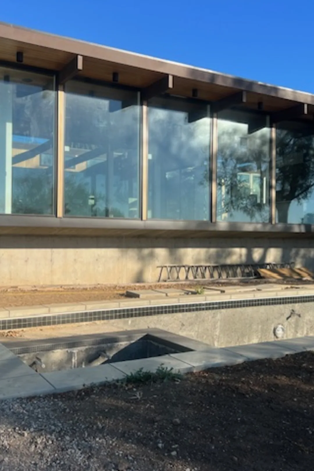 Busch Drive: the glass-and-timber pavilion nearing completion on its Malibu hillside.