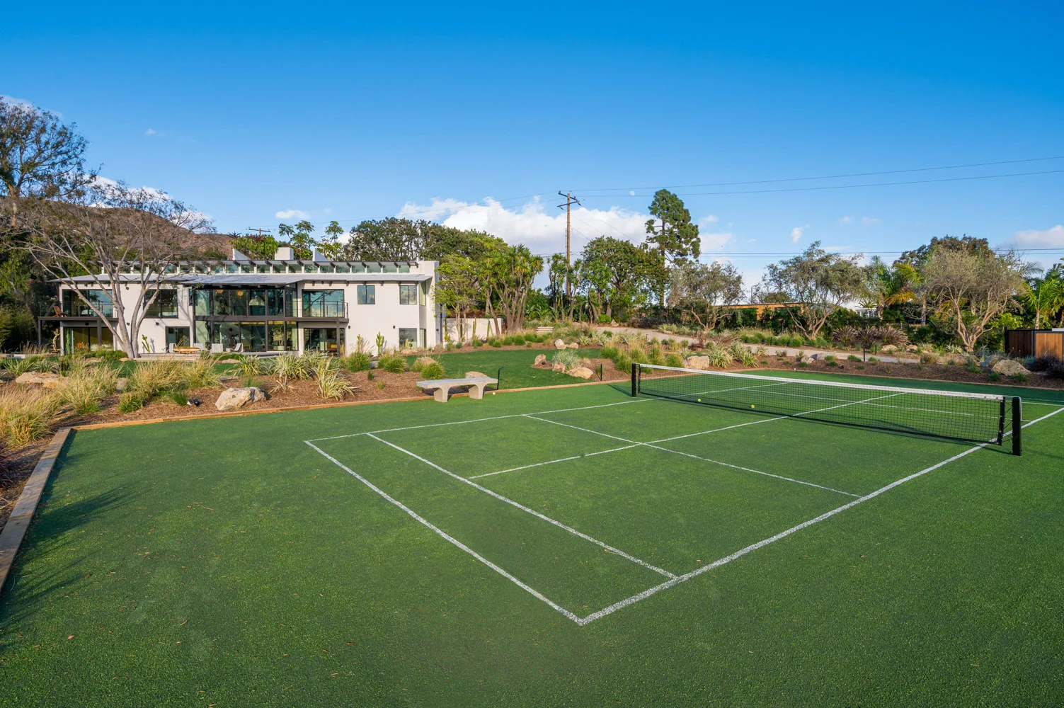 The paddle court below the house.