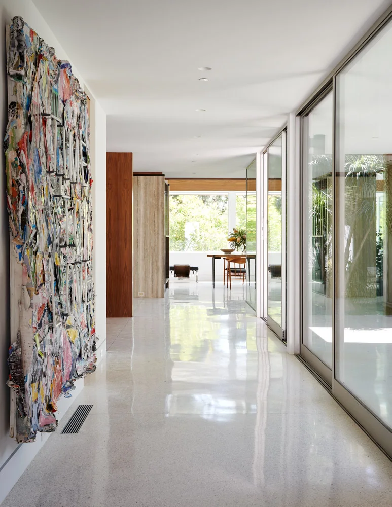 The hallway with a large abstract canvas.