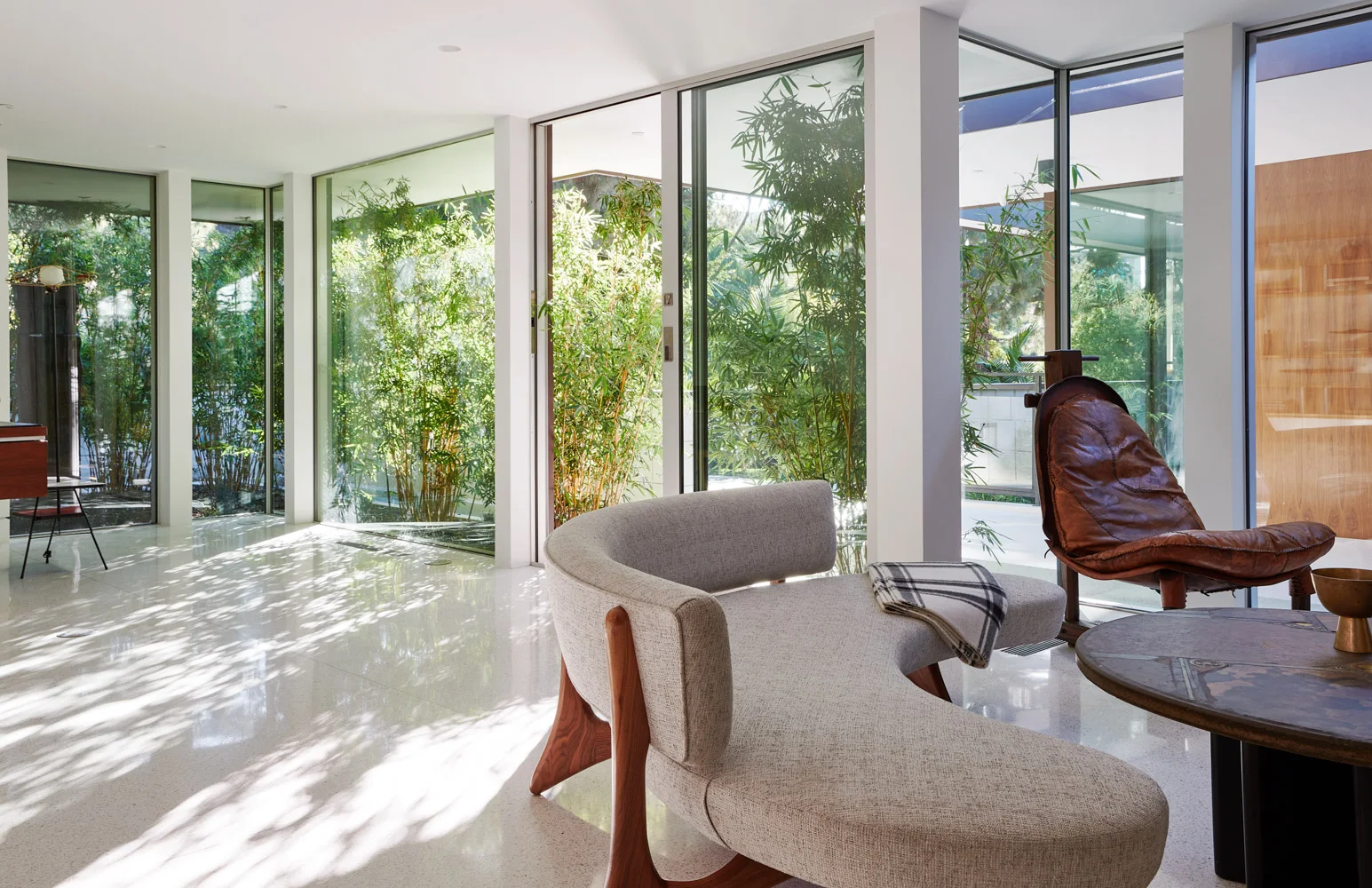 The office: a white chair among the glass.