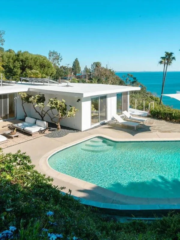 Seaboard Road: the white mid-century house and its pool on the bluff, the Pacific beyond.