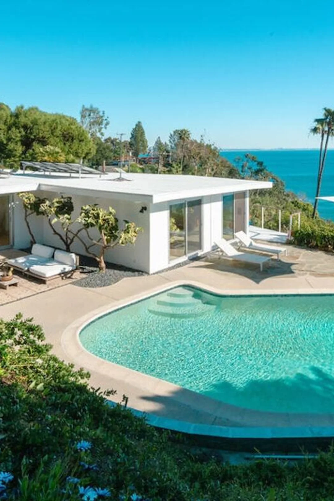 Seaboard Road: the white mid-century house and its pool on the bluff, the Pacific beyond.
