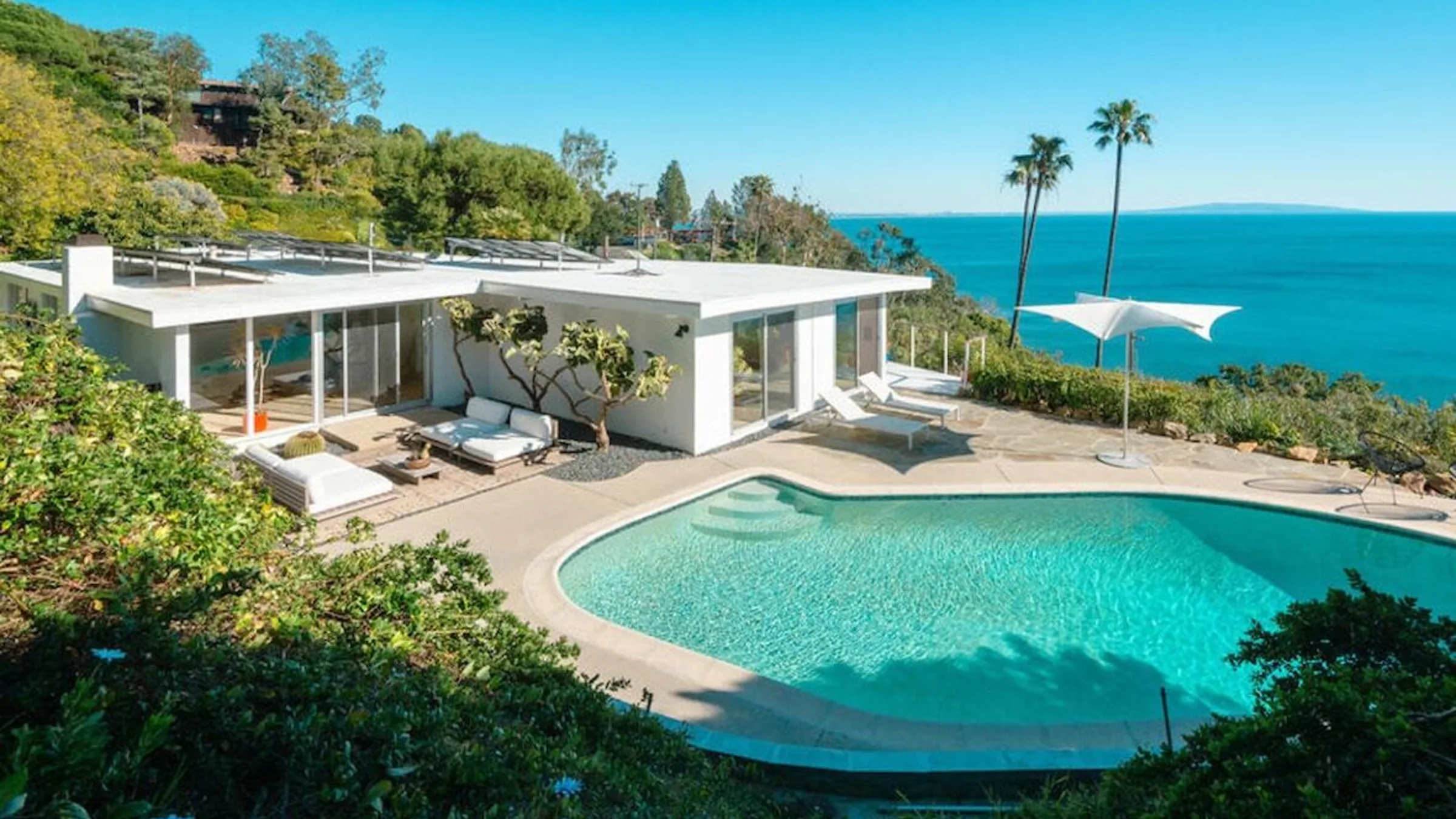 Seaboard Road: the white mid-century house and its pool on the bluff, the Pacific beyond.