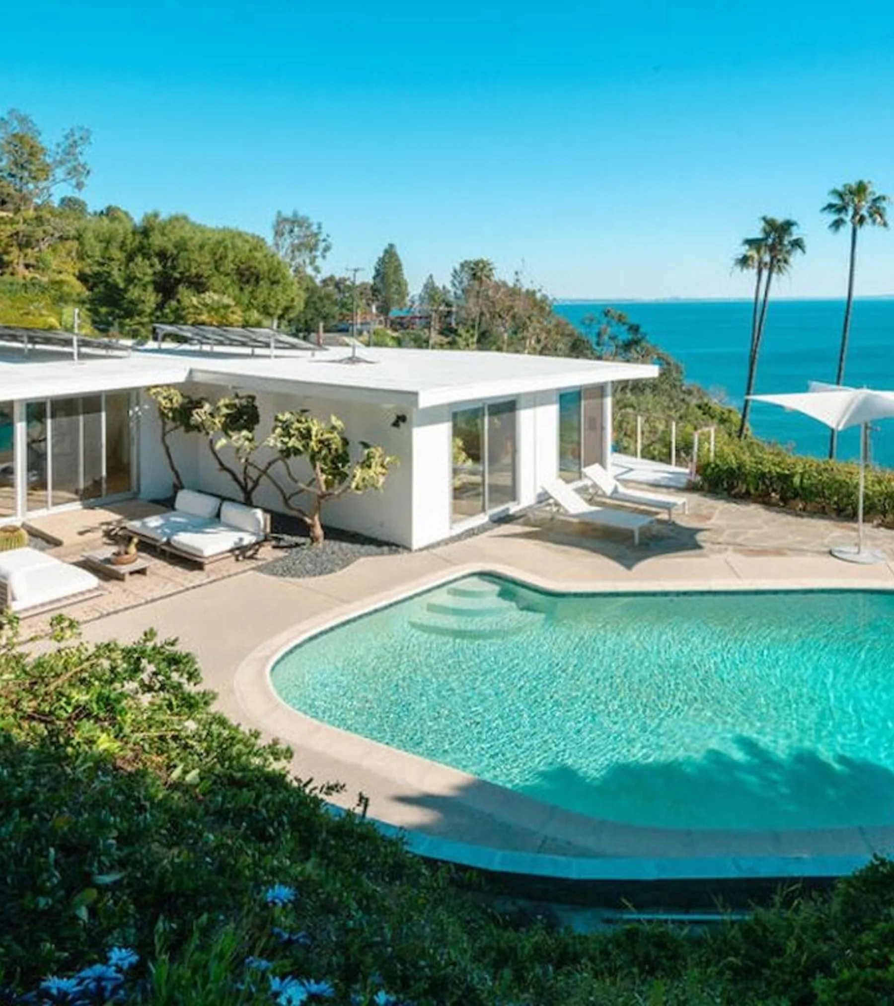 Seaboard Road: the white mid-century house and its pool on the bluff, the Pacific beyond.